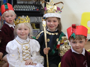Island children act out the Coronation service