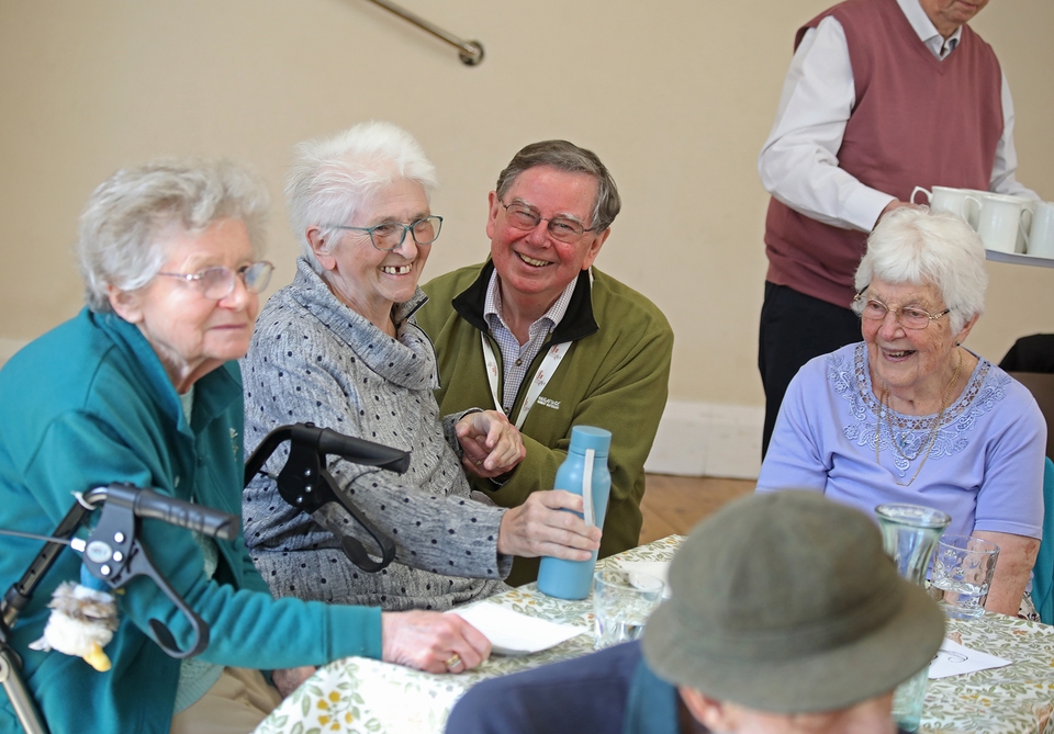 Anna Chaplain Dennis Chandler offers a blessing to those attending the Anna Café Church