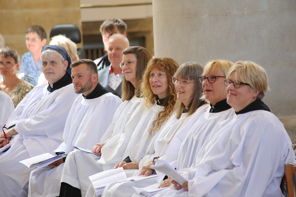Some of the 18 ordination candidates listen to the sermon