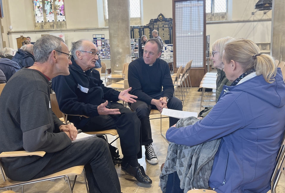 Delegates gathered in groups to share and discuss next steps