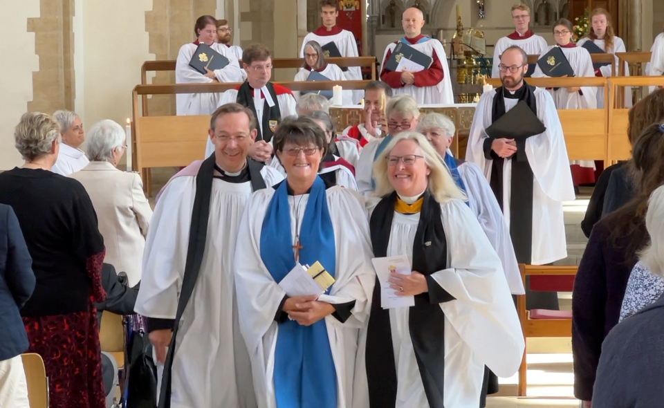 The new Readers process out of the cathedral accompanied by their parish incumbents