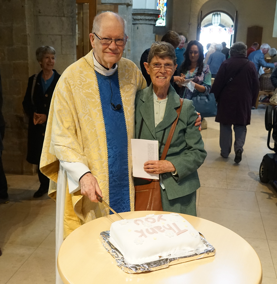 Rev Anthony Smyth with his wife Alison, cutting his retirement cake