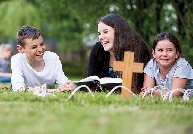 Teenagers reading the bible