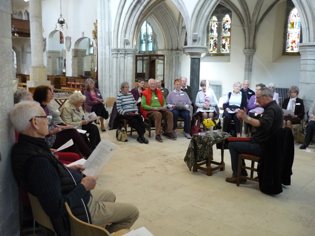 A circle of people enjoy a session on prayer and spirituality