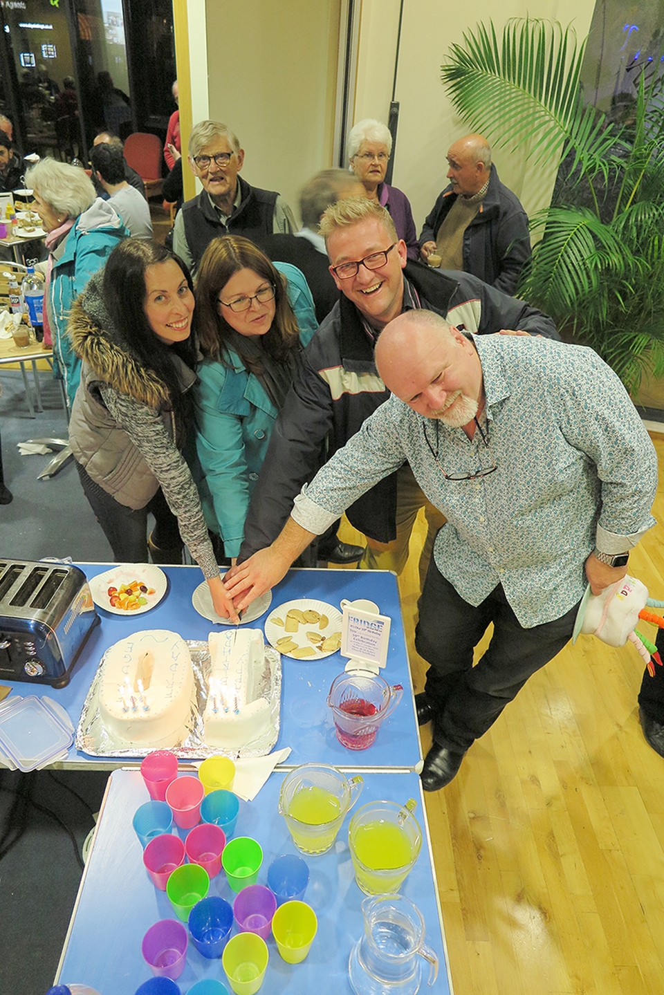 The original founders cut a cake to mark 10 years of Friday Fridge