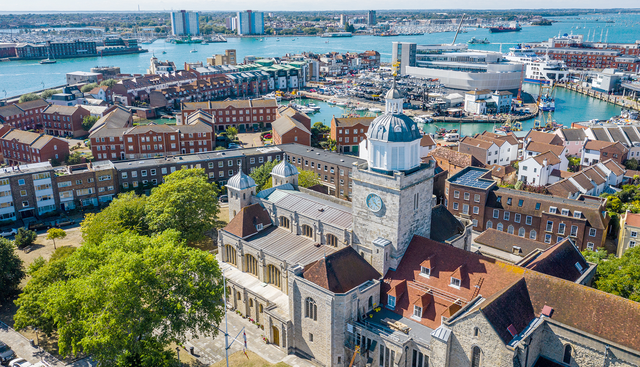 An aerial view of Portsmouth Cathedral with the harbour and Gosport in the background
