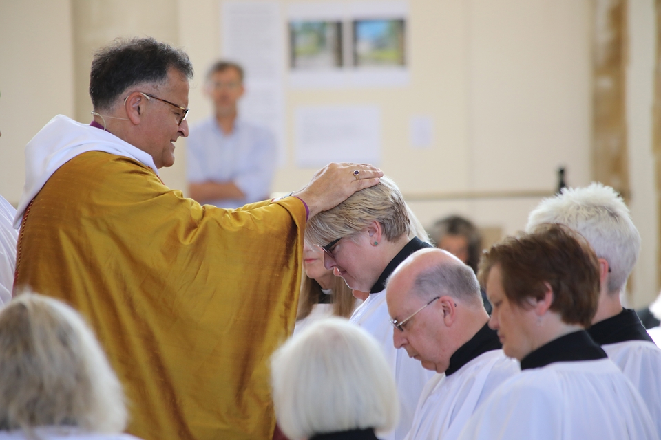 The bishop ordains Jo Lorimer as a deacon