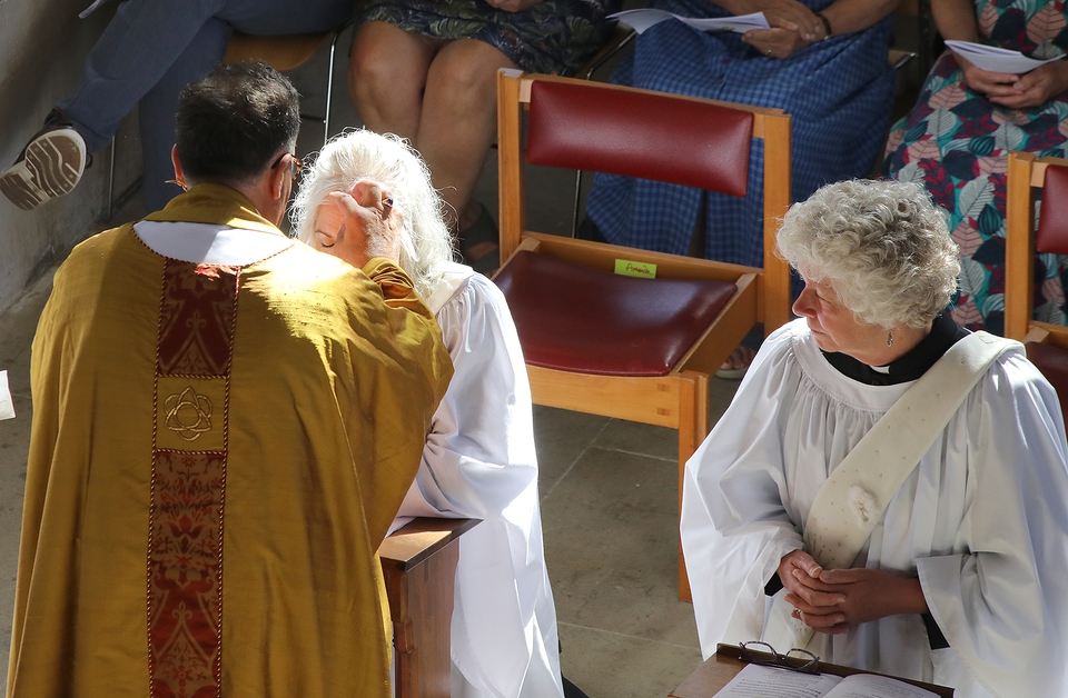 The Rev Amanda Sim is anointed by the bishop during the ordination service