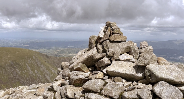 A cairn on a mountain-top is a place for us to stop and check our bearings