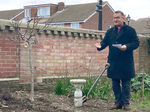 Bishop blesses newly-planted fig tree at nursing home