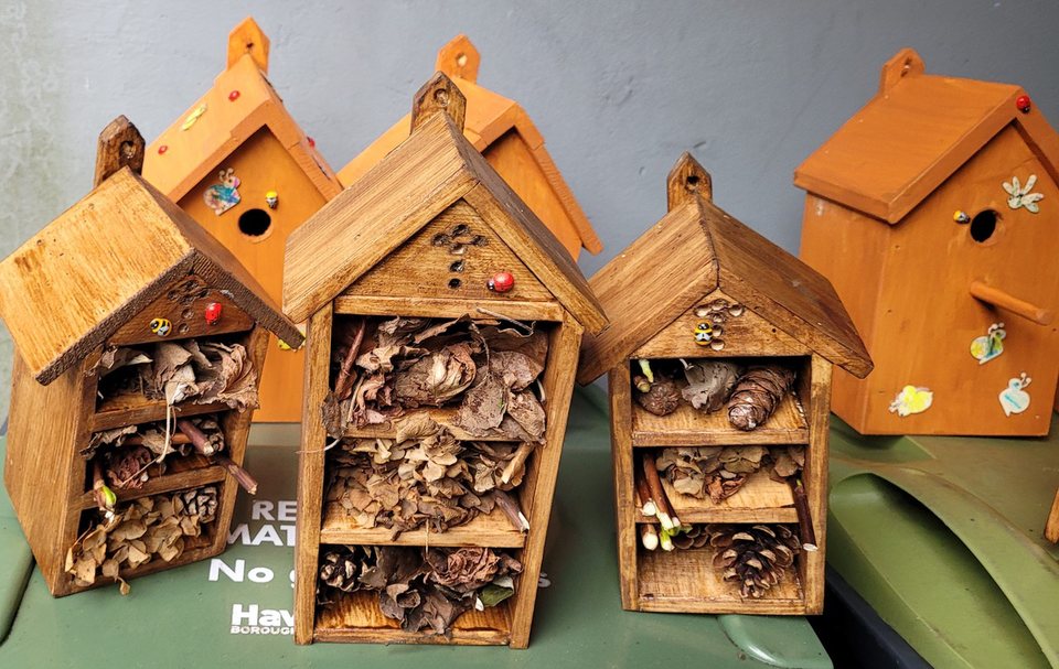 The decorated bug houses, ready for hiding around the church grounds